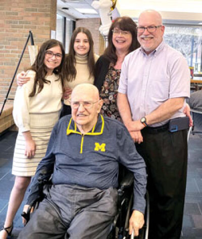  Wilbur Bigelow poses for a photo with, from the left, granddaughters Alena and Natalie Bigelow, daughter-in-law Debby Bigelow, and son Andrew Bigelow. 