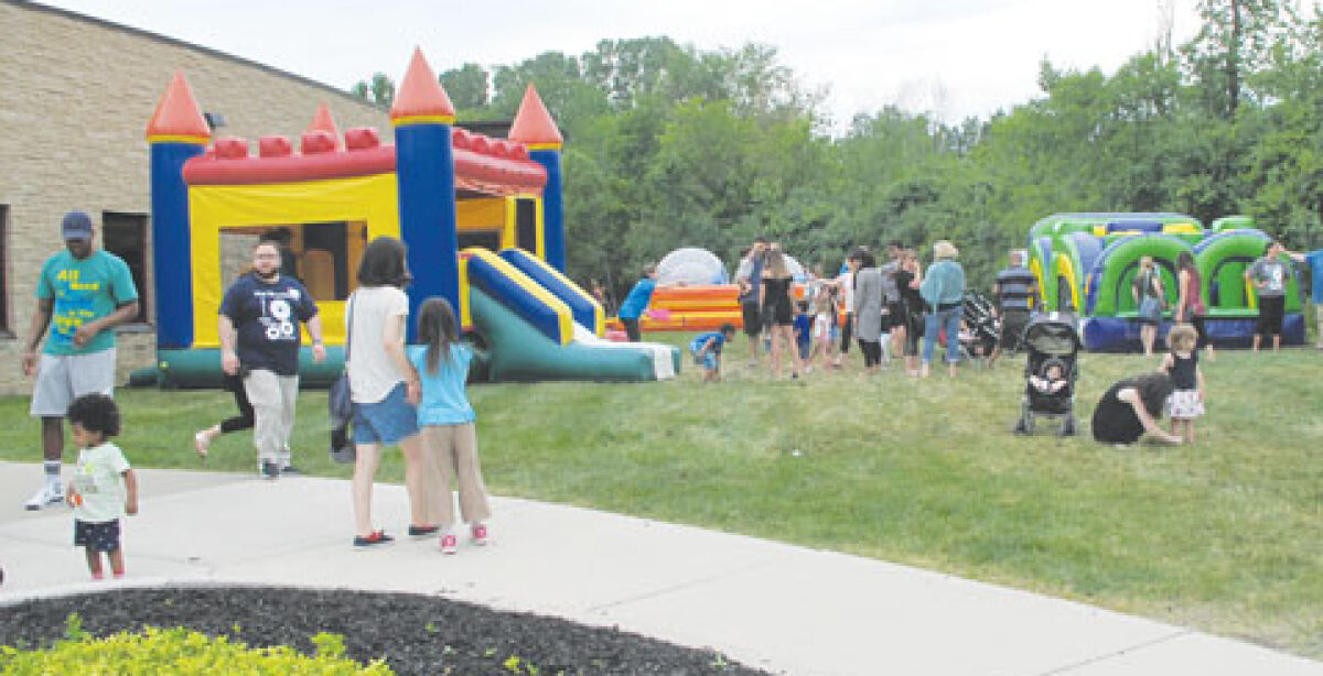  For the first time since 2019, the West Bloomfield Township Public Library is set to hold a summer reading kickoff event. Local residents are pictured at a previous event. 