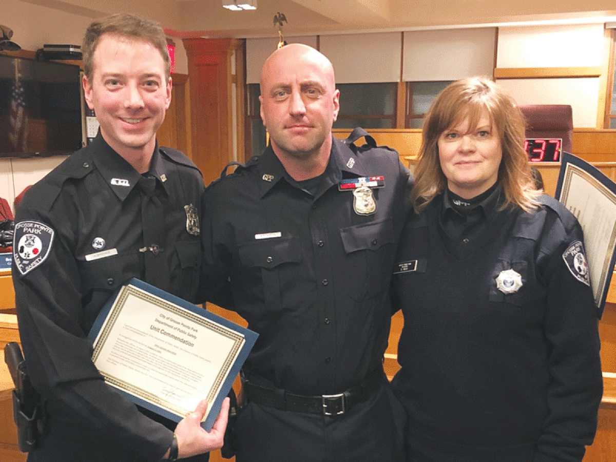  From left, Grosse Pointe Park Public Safety officer Adam Bremer, Sgt. Michael Miller and dispatcher Dawn Kelly are honored with unit commendations for their work in the arrest of a member of an organized car theft ring. 