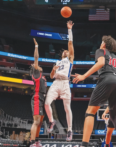  L’Anse Creuse senior Caron Williams lays it up against Port Huron at the “Court of Dreams” at Little Caesars Arena on Feb. 4. 