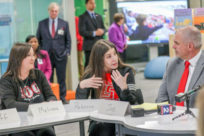  Rodgers Elementary School social worker Rebecca Asni, center, talks with parent Melissa Florek and Lake Shore Superintendent Joseph DiPonio about the stresses that students face. 