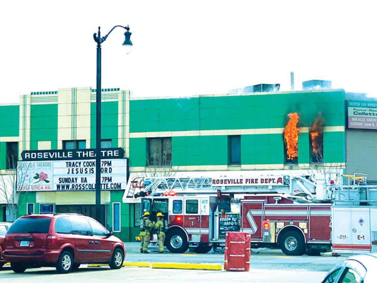  Flames are seen coming out of the Roseville Theatre March 24. 