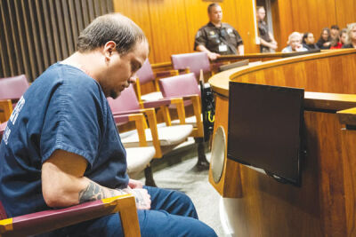  Dennis Justus is seated in the jury box during his sentencing Wednesday, May 18, in the 16th Circuit Courthouse in Mount Clemens. 