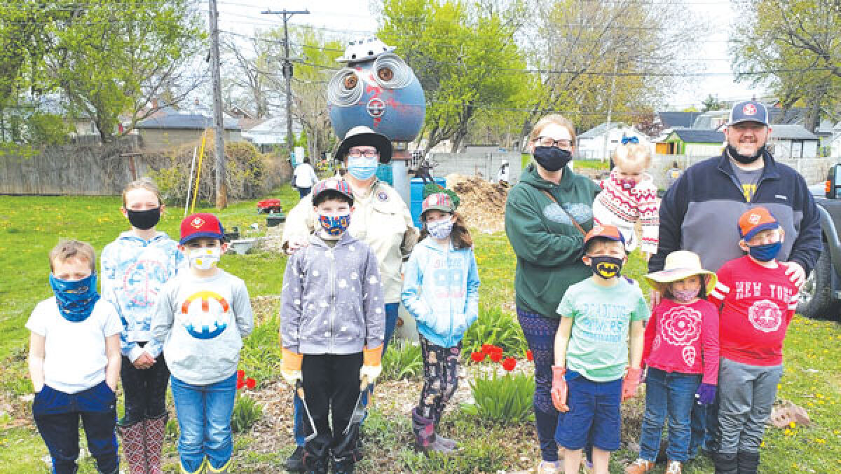  A group of volunteers pose for a photo after a previous cleanup of the Eastpointe Community Garden. 