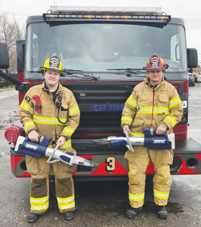  From left, Grosse Pointe Farms public safety officer Michael Ryan and Lt. Wes Kipke hold two of their newly purchased hydraulic tools, which can be used to rescue accident victims trapped in a wrecked vehicle. Ryan and Kipke were among those who underwent training to use the equipment on vehicles March 30 and 31. 