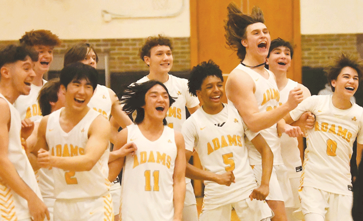  Rochester Adams is fired up after their regional-winning victory over Clarkston March 15 at Fenton High School. 