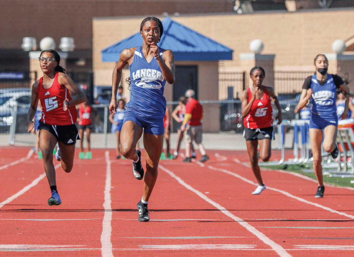  L’Anse Creuse senior Ke’vina Finch competes in the 100-meter during the meet. 