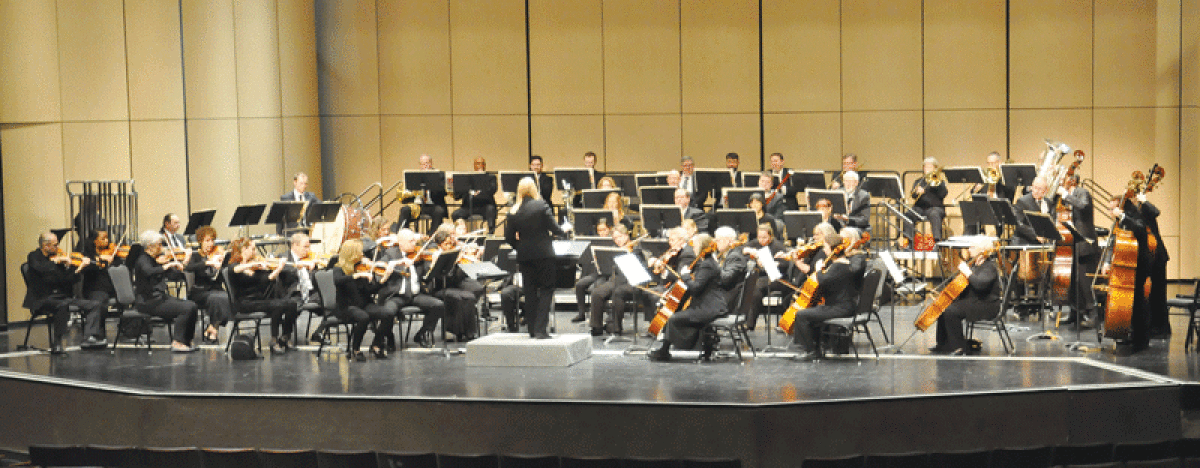  Musicians of the Warren Symphony Orchestra prepare for an Out of This World performance on April 23.  