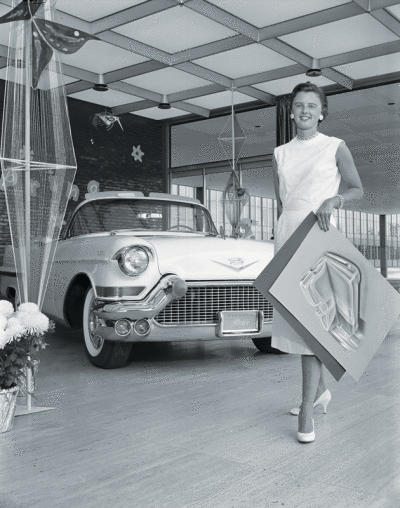  Suzanne Vanderbilt with the 1958 Cadillac Saxony Series 62 convertible with an interior she designed.  