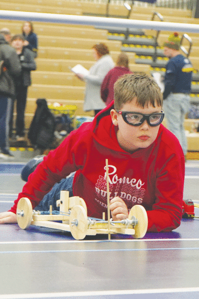  Logan White, of Romeo Middle School, competes in the wheeled vehicle category. 