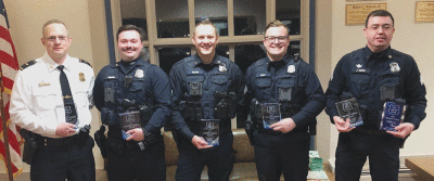   From left, Grosse Pointe Shores Public Safety Lt. Tony Spina, officer Paul Morang, Sgt. Ryan Wilson, officer Billy Howe III and Sgt. Jason Cook were among those honored recently with public safety awards for their work last year.  