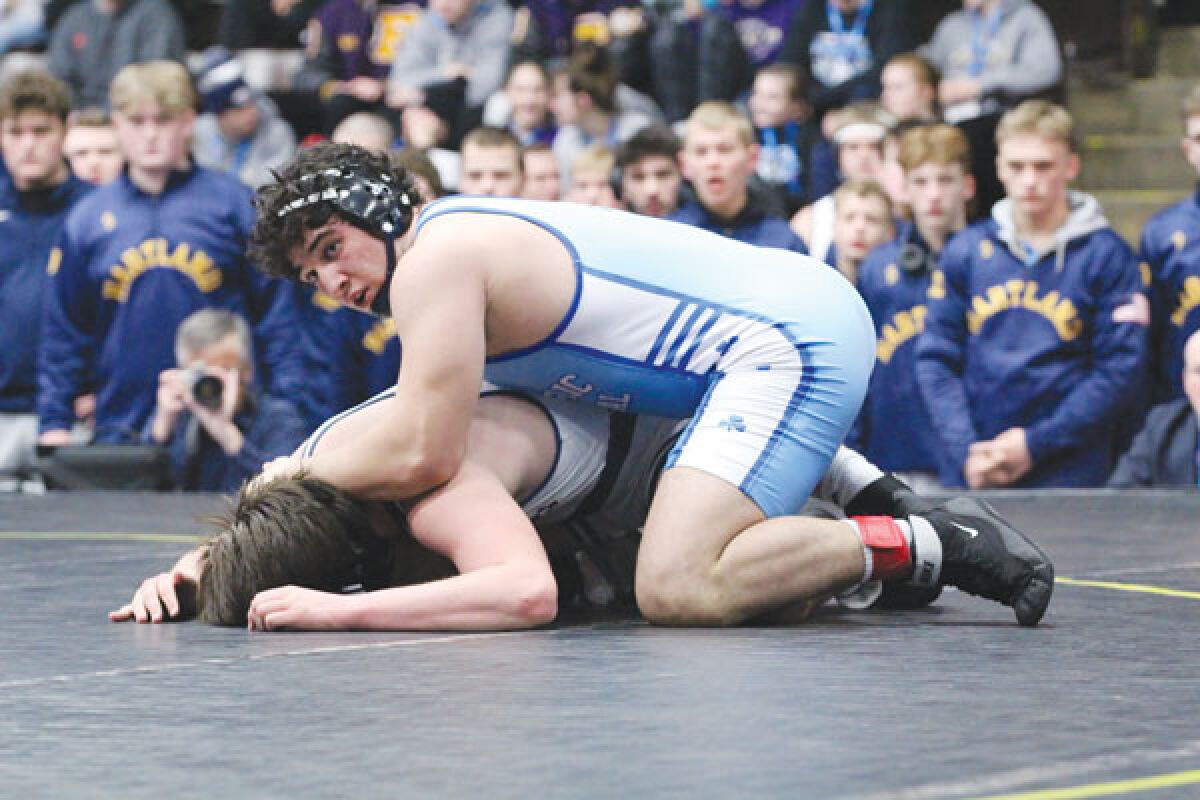  Detroit Catholic Central sophomore Connor Bercume takes on a Hartland wrestler during the Michigan High School Athletic Association Division 1 Team Finals at Wings Event Center in Kalamazoo. 