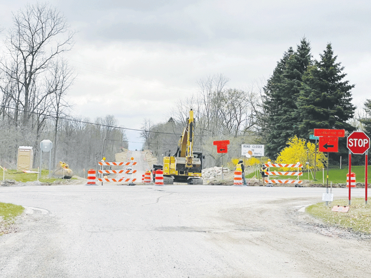  Crews work to pave Clarkston Road between Adams and Lake George roads in Oakland Township. 