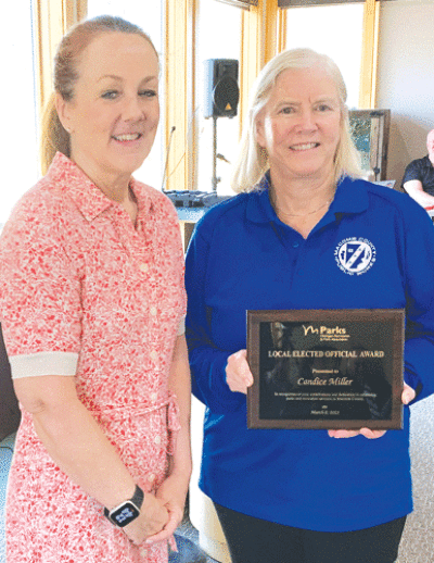  Macomb County Public Works Commissioner Candice S. Miller receives the Michigan Recreation & Park Association’s “Local Elected Official Award” from Amy McMillan, director of the Huron-Clinton Metroparks, on April 13. 