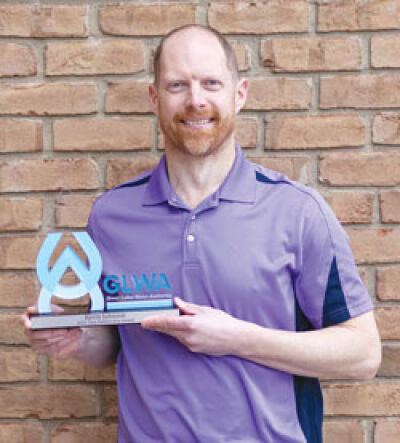  Kevin Johnson, director of the Macomb Township department of public works, poses for a photo with the Great Lakes Water Authority’s True Partnership award. 