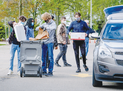  National Honor Society student volunteers from Grosse Pointe North High School assist residents during Shred Day 2021 in Grosse Pointe Shores. This year’s event is scheduled for May 13. 