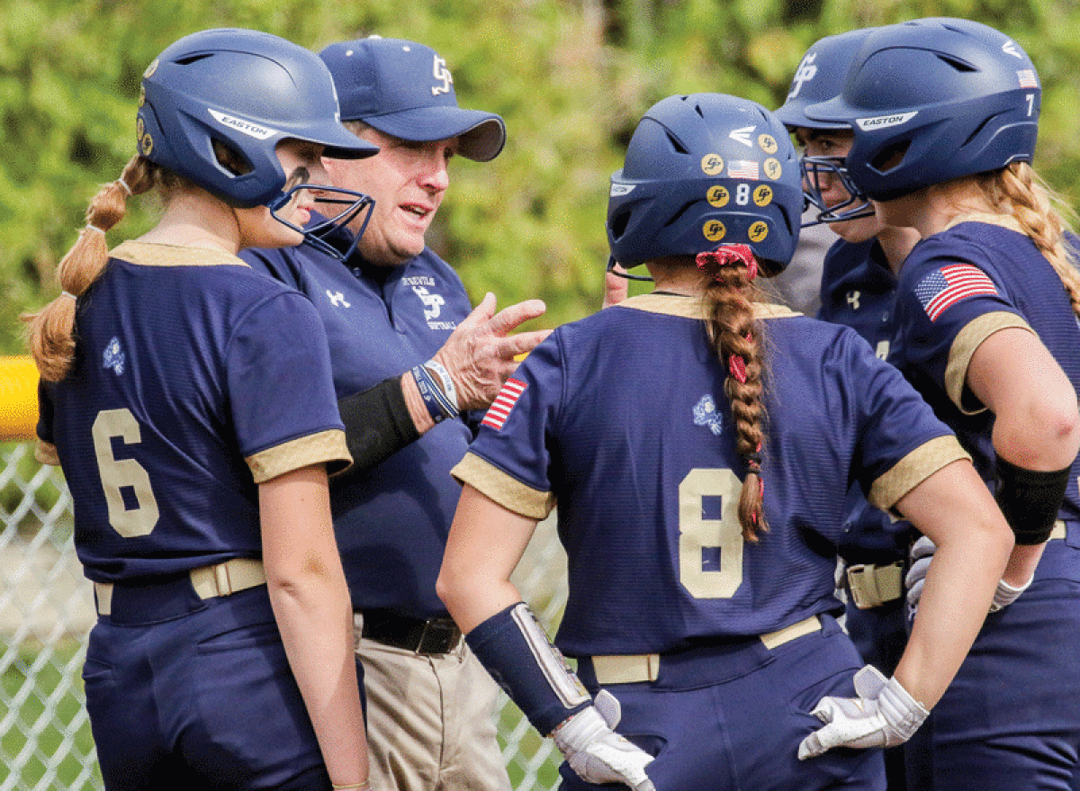   Grosse Pointe South coach Bill Fleming has a conversation with his team during its game against Port Huron on April 20 at South High School. 