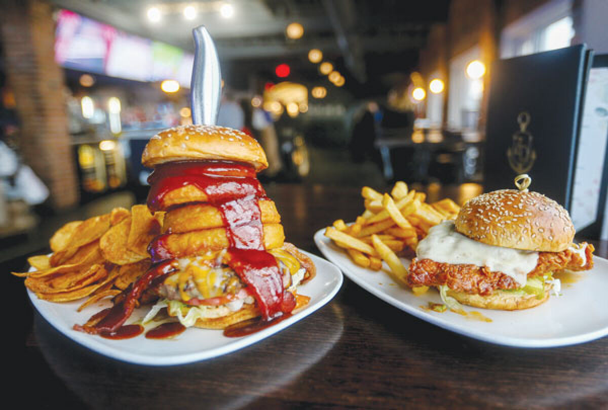  The Dockside burger and Nashville chicken sandwich await patrons at Zef’s Dockside Bar and Kitchen during Nautical Mile Restaurant Week May 13-21. 