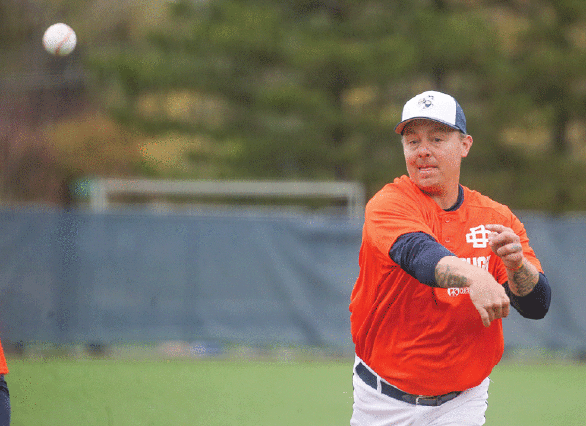  Former Detroit Tigers third baseman Brandon Inge, father of Country Day junior shortstop Tyler Inge, throws out the ceremonial first pitch. 