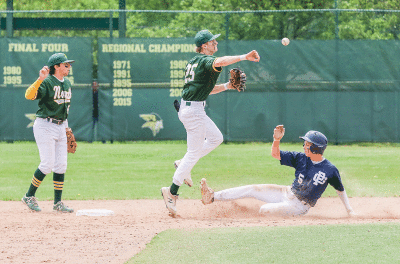  Grosse Pointe North senior James Macauley looks to complete the double play in North’s 9-2 win over Grosse Pointe South in the first round of districts at Grosse Pointe North High School. 