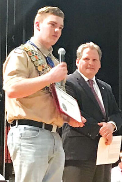  Roseville High School senior William Scheinpflug, left, receives congratulations on earning Eagle Scout rank from Roseville Community Schools Superintendent Mark Blaszkowski. 