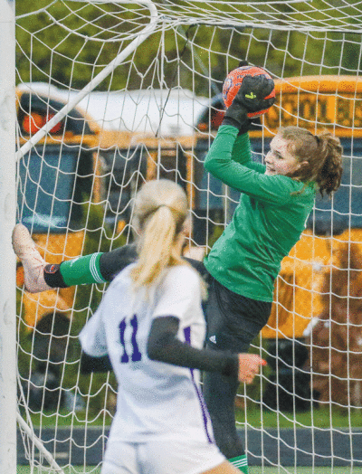  Rochester sophomore goalkeeper Alice Max  makes the save during Rochester’s 0-0 tie against  Bloomfield Hills April 18. 