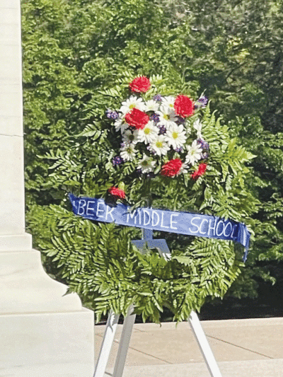  The floral arrangement included various flowers  and a ribbon that read “Beer Middle School.” 