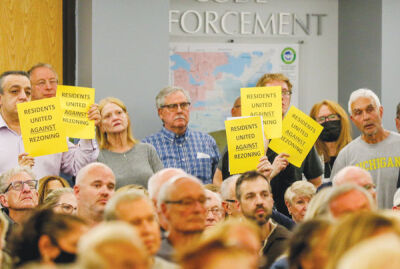  A proposed development at The Corners property on Walnut Lake Road was met with opposition by residents at a West Bloomfield Township Planning Commission meeting last year. 