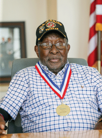  Lee Newby sports his U.S. Marines cap having just been honored by the mayor. 