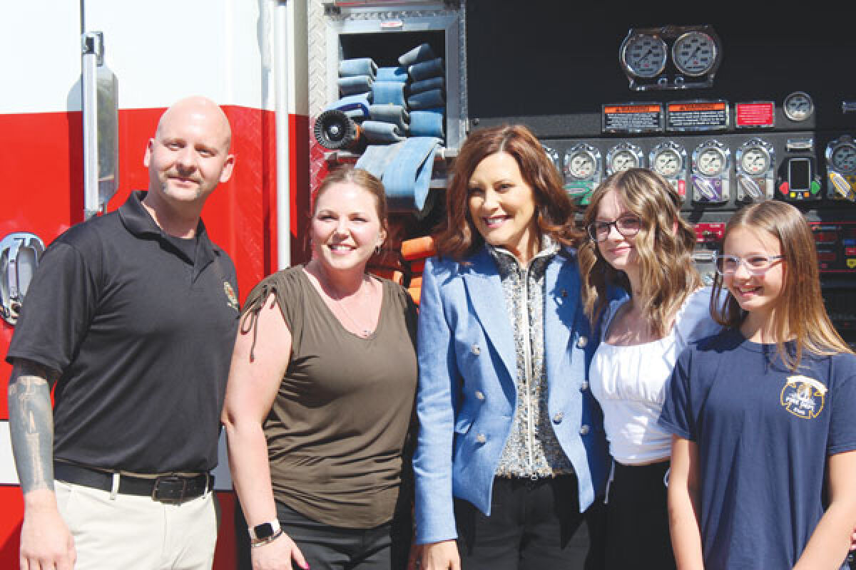  From left, Gov. Gretchen Whitmer stands with Robert Cook, president of the St Clair Shores Fire Fighters Union Local 1744, his wife Diana Cook, daughter Allison Cook and daughter Lily Cook. 