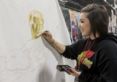  “Chalk Girl” Beth Zwolski Tobias works on a portrait of actor Will Poulter as Adam Warlock in the most recent “Guardians of the Galaxy” movie. The actor is scheduled to be a guest at the con and Tobias is hoping to show the piece to him. 