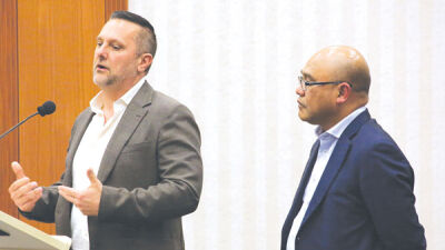  Priority Waste CEO Todd Stamper, left, and Vince Hoyumpa, chief of staff and counsel, asked the Macomb Township Board of Trustees to table its decision to choose GFL Environmental as the township’s next waste hauler. The township voted unanimously to go with GFL. 