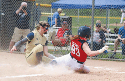  Country Day’s Lola Bagby places the tag on a Stevenson runner breaking for home. 