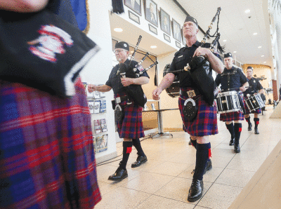  Metro Detroit Police and Fire Pipes and Drums lead the procession with music. 