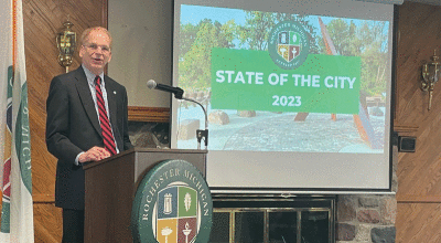  Mayor Stuart Bikson shares a positive outlook for the city to a packed room of community members  gathered at The Community House May 10 to hear his address.  