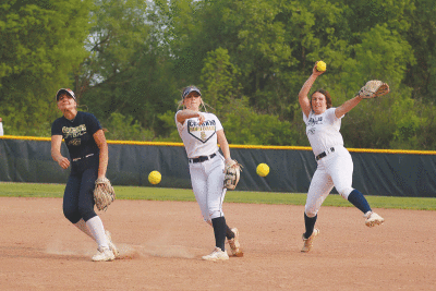  Stoney Creek pitchers work alongside each other during a team practice. From the left are junior Morgan Greenwald, senior Maddie Laviolette and junior Erin Flynn. 