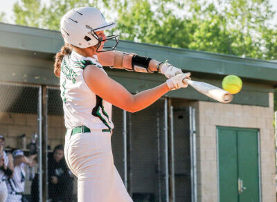  Junior Emma Prahin barrels up a pitch during Novi’s game against West Bloomfield on May 15 at Novi High School. 