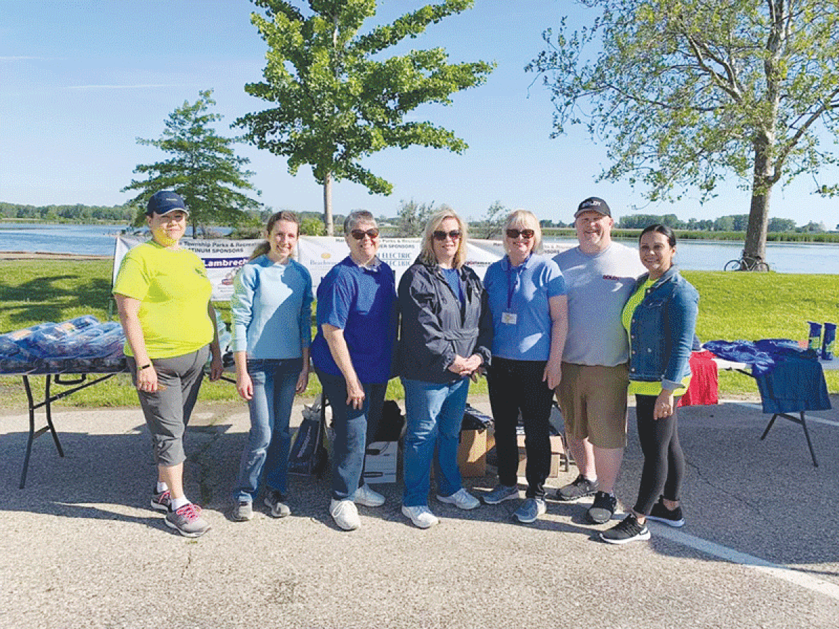  Volunteers for the 2022 Harrison Township Kids Fishing Derby gather around for a photo. The 18th edition of the derby will take place from 8 a.m. to 11 a.m. on June 10 at Lake St. Clair Metropark.  