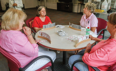   Seniors play cards at Next last week. Next is the 50-plus community center in Birmingham that offers several daily activities for seniors.  