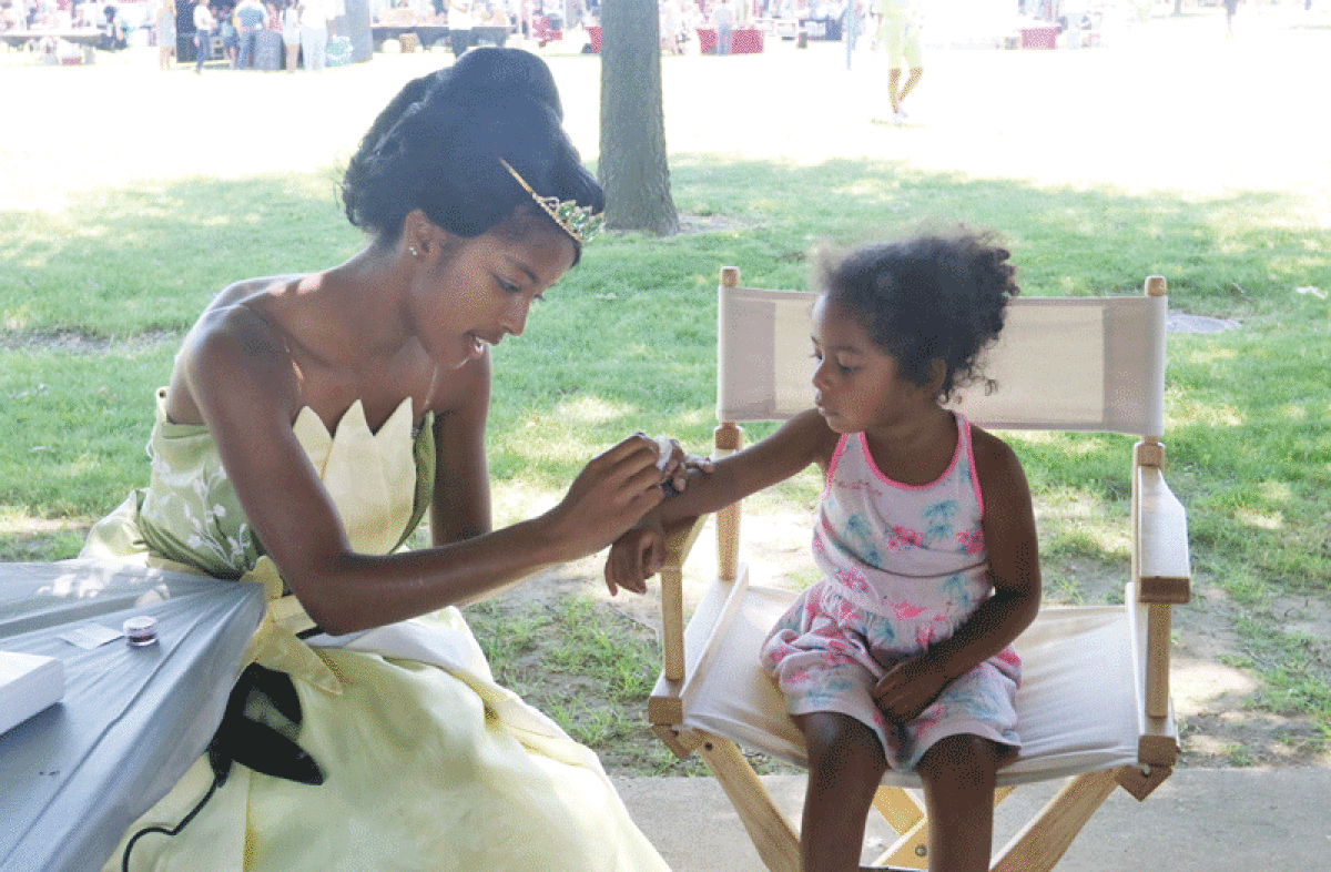  At last year’s Juneteenth celebration in Madison Heights, Colette Vandervest, of Grosse Pointe, received a painted tattoo from Princess Tiana. Attendees enjoyed live music, educational exhibits, children’s activities, a rib contest and more. This year’s event will be at Civic Center Park June 17. 