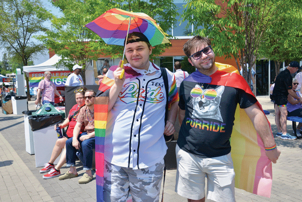  Steven Smith, of Lincoln Park, and Sean Murphy, of Hazel Park, show their pride during Ferndale Pride  June 3. 