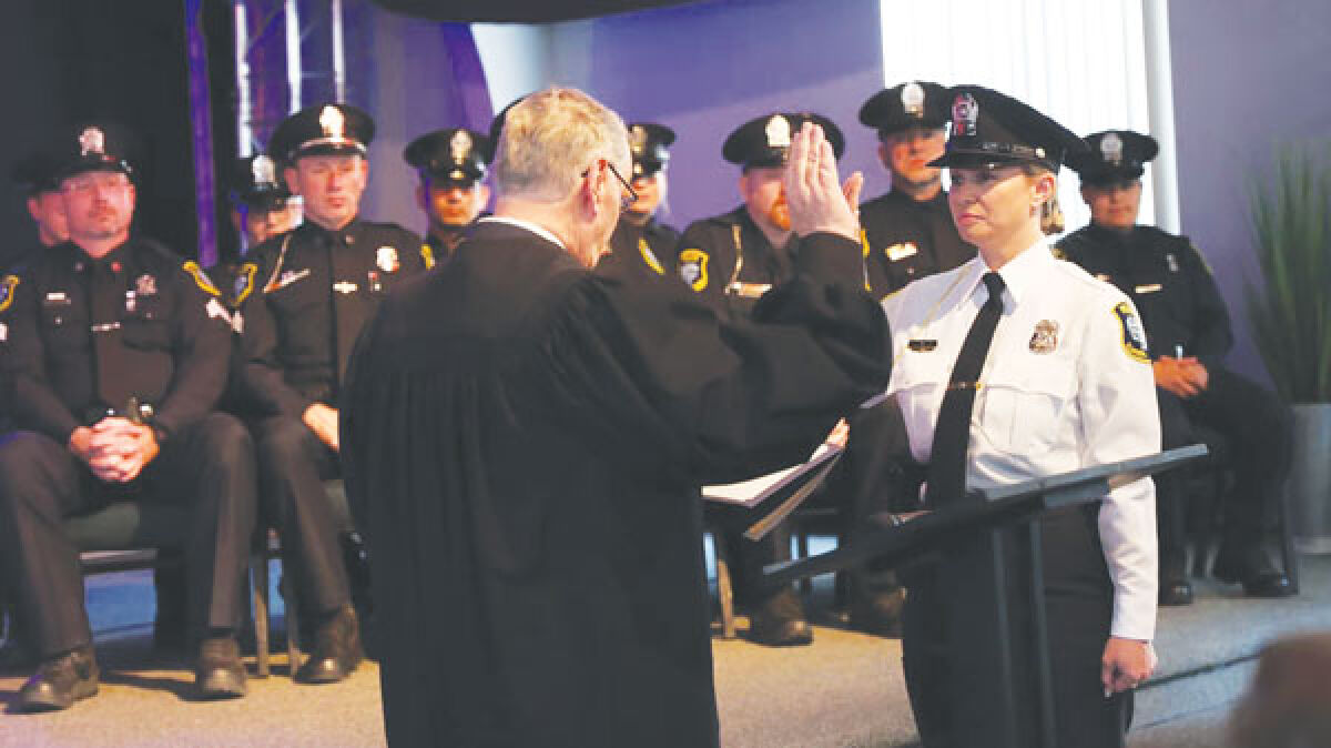  Kellie Bauss is sworn in as Clawson’s police chief on May 17. She is the department’s first female chief. Bauss has been with the Clawson Police Department for 18 years. 