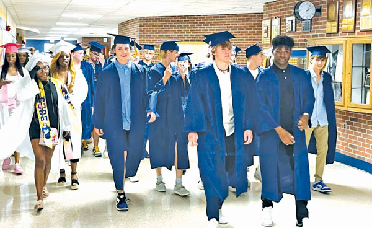  Each year, the graduating class of Fraser High School takes one last walk past their fellow students and out onto the football field to meet with their families. 