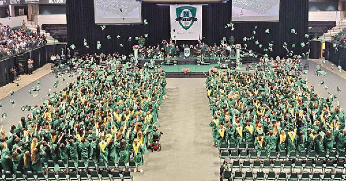  The members of Novi High School’s Class of 2023 celebrate graduation by throwing their caps in the air during the school’s commencement ceremony at Eastern Michigan University in Ypsilanti. 