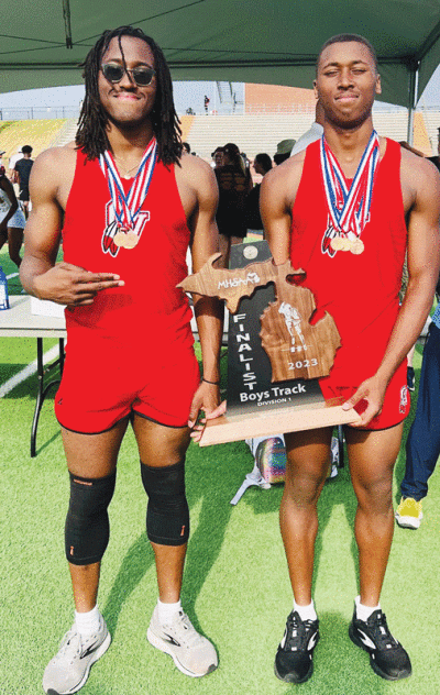  Senior Jonas Morris, left, and junior Noah Morris, right, teamed up with juniors Shamar Heard and Chris Estell to win the state title in the 4x200 relay on June 3 at Rockford High School. 