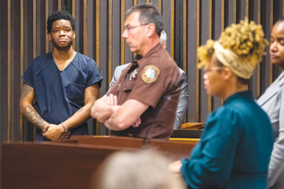  Jaylin Brazier, left, becomes emotional while listening to Ciera Milton, Zion Foster’s mother, address the court during his sentencing Wednesday, March 30, 2022, in the 16th Judicial Circuit Courthouse in Mount Clemens. 