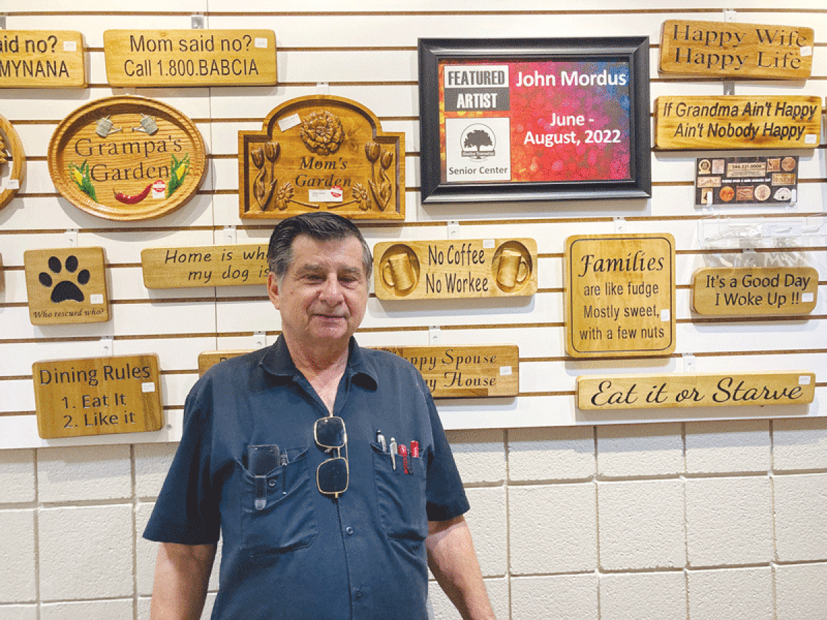  John Mordus is the Shelby Township Senior Center’s featured artist for the months of June through August. He designs, cuts and paints signs and plaques. 