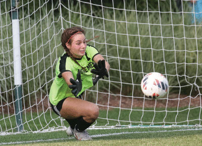  North senior goalkeeper Grace McCormick makes a save during the shootout.   