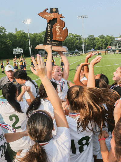  Grosse Pointe North celebrates its first state championship in school history. 