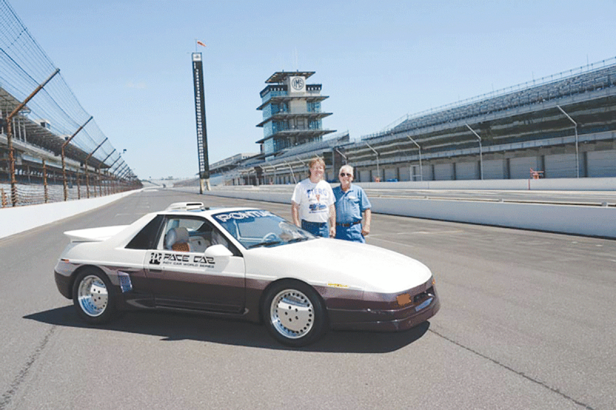  Fred Bartemeyer, left, and John Callies pose with Bartemeyer’s 1984 Indy PPG Fiero Pace Car. 
